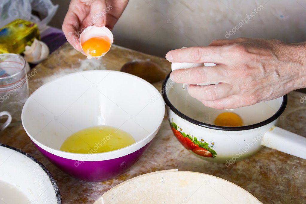 Woman breaks raw egg