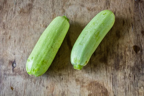 Fresh zucchini On wooden background. — Stock Photo, Image