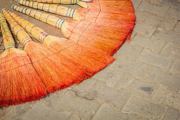 Brooms on the pavement — Stock Photo, Image