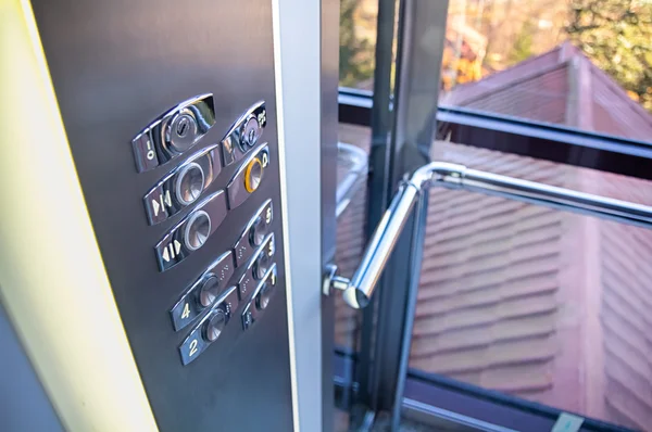 Trendy elevator with transparent walls Stock Picture