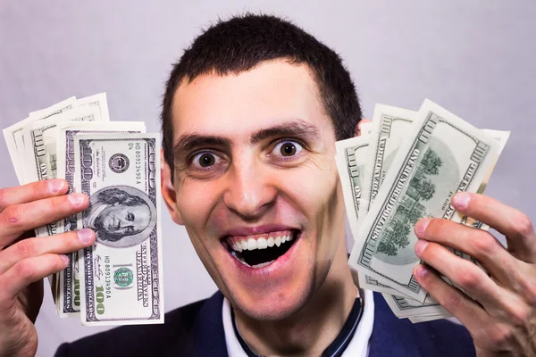 Man holding dollars and rejoices Stock Image