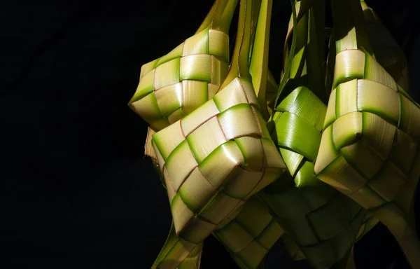 Ketupat Lebaran, a rice cake packed inside a diamond shaped container of woven coconut leaves, served in the end of Ramadan and in Eid Fitr (Eid Mubarak) in Indonesia, Malaysia, Brunei and Singapore