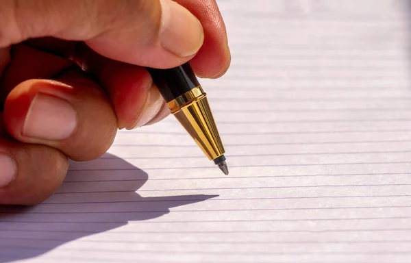 Left Handed Writing Gold Pen Shallow Focus White Lined Paper Stock Photo