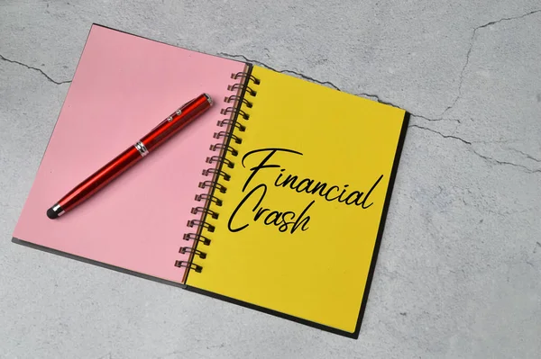Notebook written with text FINANCIAL CRASH.