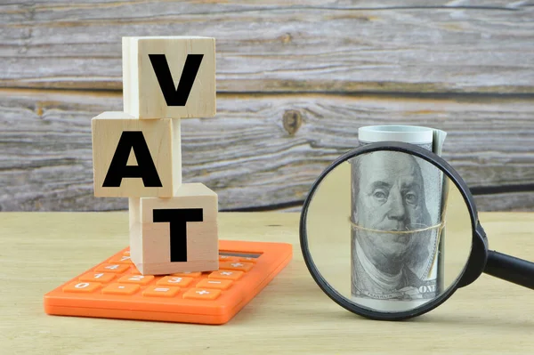 Wooden cubes written with VAT stands for VALUE ADDED TAX.