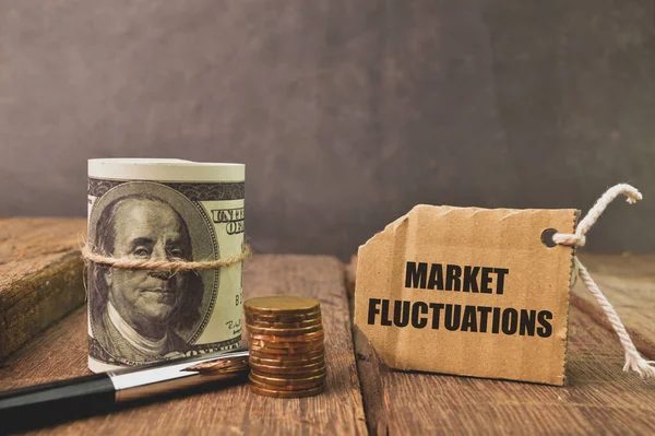 Market fluctuations and coins over grey background