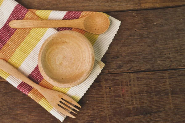Top view of wooden cutlery utensil (fork, spoon and plate) on wooden table — Stock Image Top View Wooden Cutlery Utensil Fork Spoon Plate Wooden Table Stock Photo