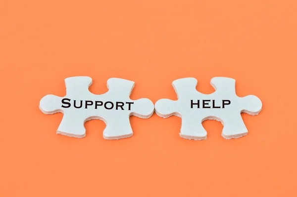 Jigsaw Puzzle Written Support Help Orange Background — Stock Photo, Image