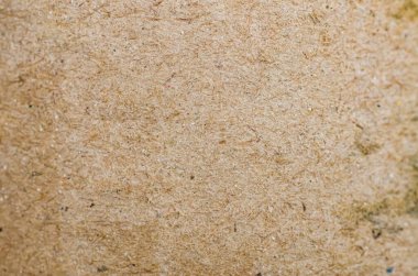 Parçacık Tahtası Yüzeyinin Kapanışı Sıkıştırılmış Ahşap İplikleri ve Çok Renkli Noktaları Gösteriyor