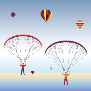 Yamaç paraşütü ve balon gökyüzünde.