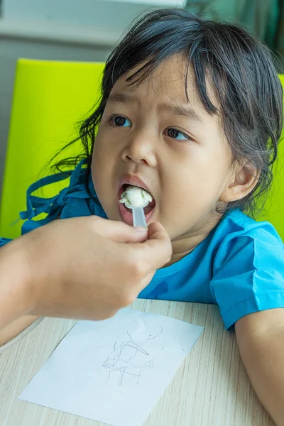 Illness asian kids eating cereal, saline intravenous (IV) on han — Stock Photo, Image