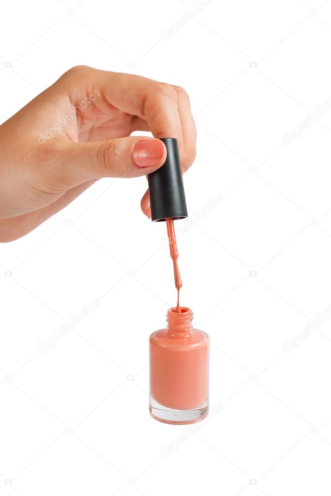 Nail polish. Close-up of female hand holding a nail polishing br