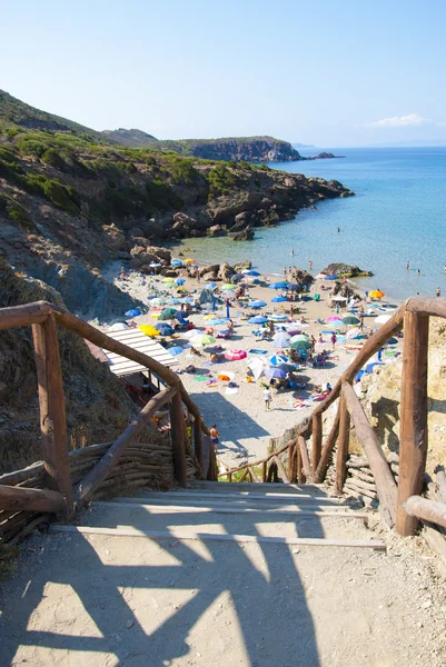 Masua Beach in Nebida crowed in summertime seen from the top — Stock Photo, Image