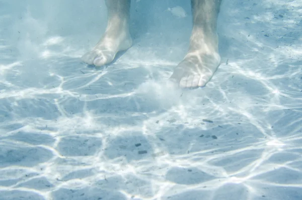 Male feet underwater in the sea — Stock Photo, Image