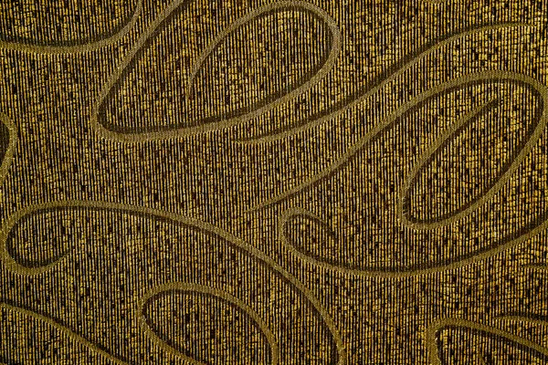 Gamla prydnadsväxter texturerat mörka gula embroideryered tyg textur — Stockfoto