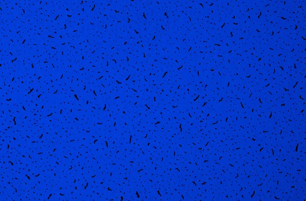 Blå abstrakt grunge paper makro konsistens med svarta prickar — Stockfoto