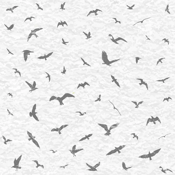 Siluetas de aves voladoras sobre fondo grunge blanco. Ilustración vectorial — Vector de stock