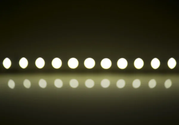 Play of light on defocusing blur led lamps background — Stok fotoğraf
