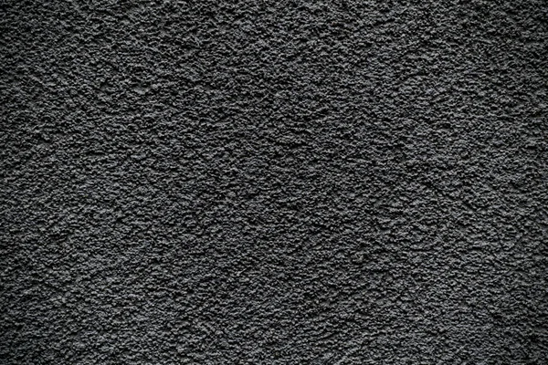 Revetment negro pared masilla macro textura fondo — Foto de Stock