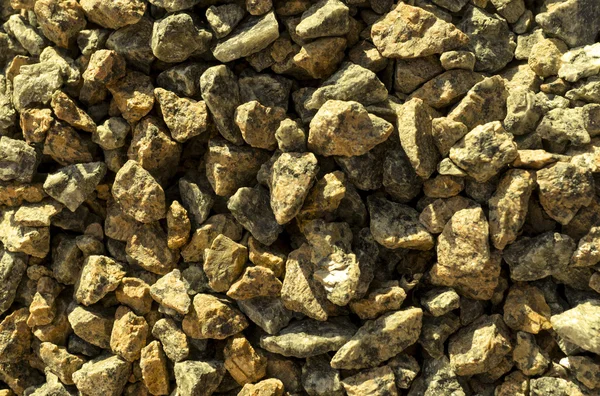 Pedras amarelas cascalho textura macro fundo — Fotografia de Stock