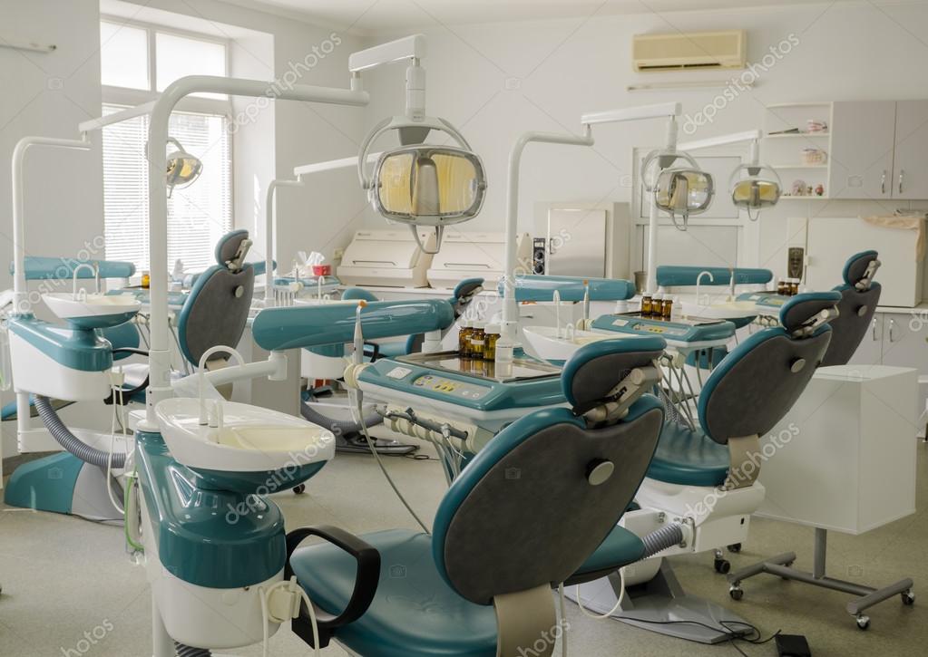 Dental office training center with many dental chairs — Stock Photo