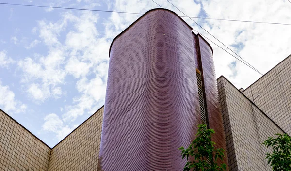 Kiev, Ukraine - July 20, 2015: Modern violet office high building with no windows