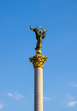 Monument of Independence of Ukraine on blue sky background in Kiev clipart