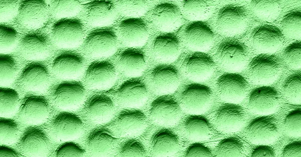 Texture of green wall plastered in form of honeycombs — Stock Photo, Image