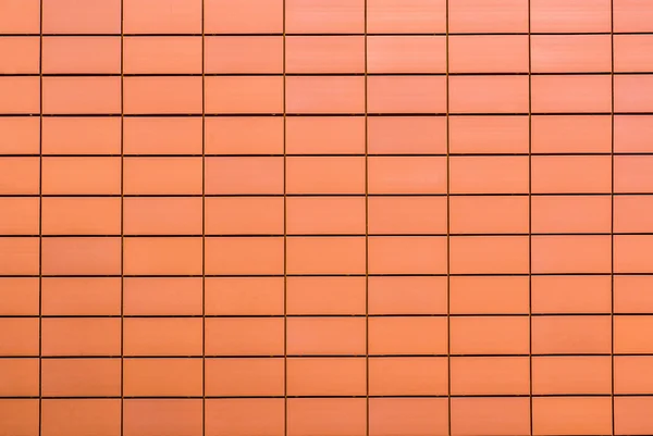 Tekstury pomarańczowy płytki dekoracyjne w postaci cegły — Zdjęcie stockowe