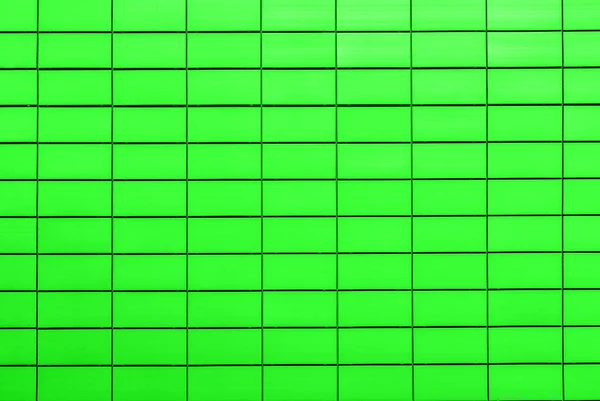 Текстура кислотно-зеленой декоративной плитки в виде кирпича — стоковое фото