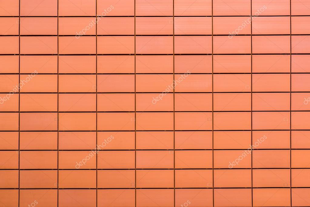 Texture of orange decorative tiles in form of brick Stock Photo by
