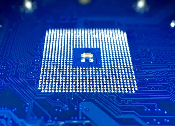 Kék számítógép alaplap és a processzor foglalat elmaszatol hatás makró — Stock Fotó