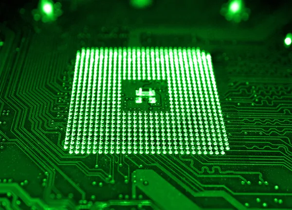 Számítógép alaplap és a processzor foglalat elmaszatol hatás makró zöld — Stock Fotó