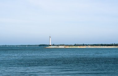 Contrast sea panorama with lighthouse on the pier filtered
