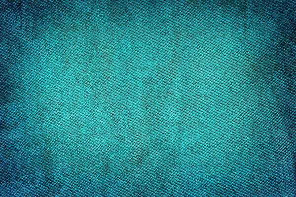 Blue fabric woven texture high contrasted with vignetting effect macro background — Stock Photo, Image