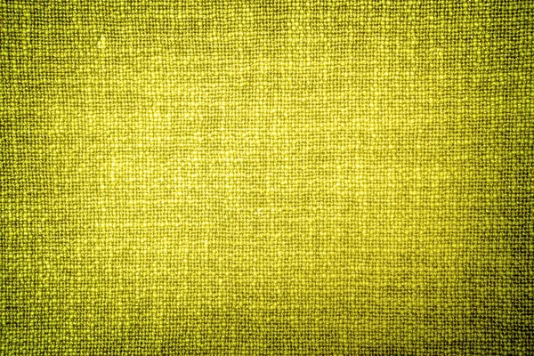 Old yellow cloth texture high contrasted with vignetting effect — Stock Photo, Image