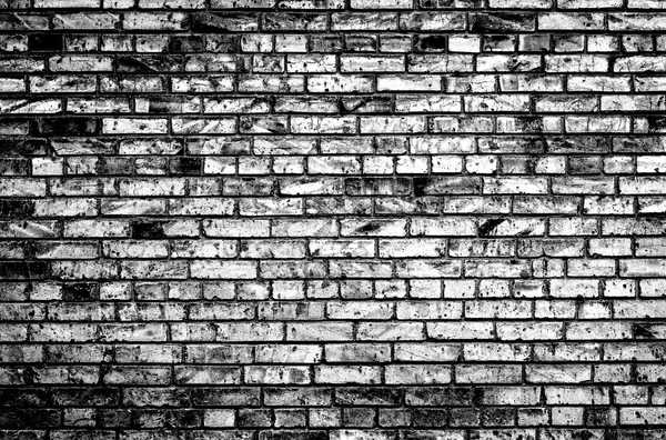 Texture of brick wall black and white high contrasted with vignetting effect — Stok fotoğraf