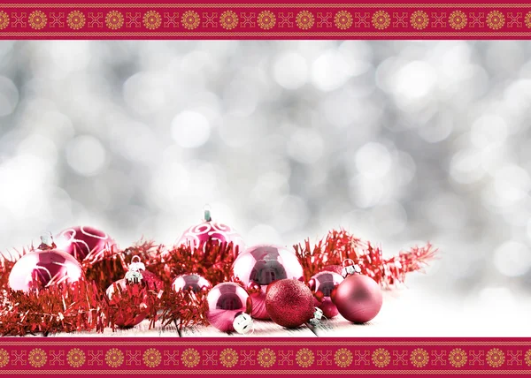 Greeting Christmas card with red balls and decorations on retro vintage white table isolated on white with red and golden ornament on blurred background — Stock Photo, Image