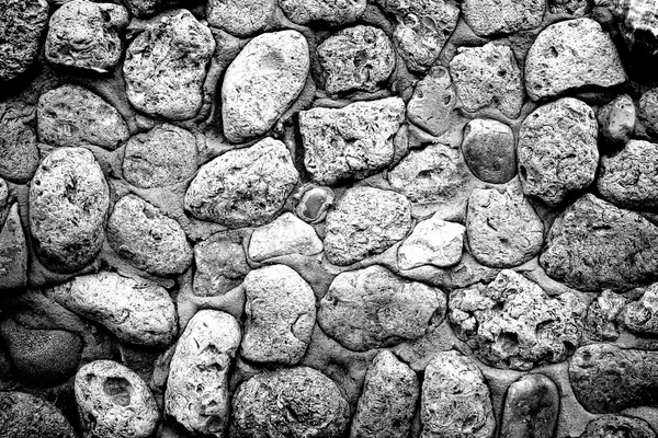 Texture of gray stone coquina wall in cement high contrasted with vignetting effect — Stock Photo, Image