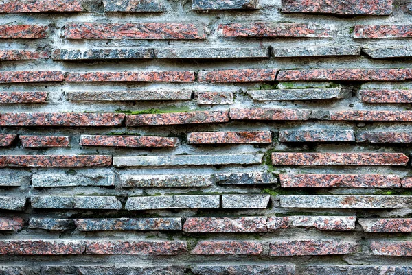 Rosso e blu marmo pietra mattone muro dettagliata texture sfondo filtrato a freddo — Foto Stock