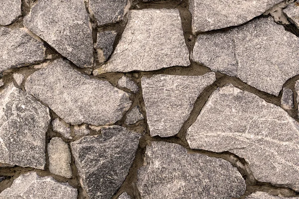 Parede velha de pedras cinzentas textura fundo quente filtrado — Fotografia de Stock