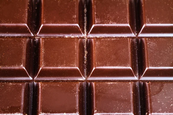 Barra de chocolate escuro, vista superior, close-up — Fotografia de Stock
