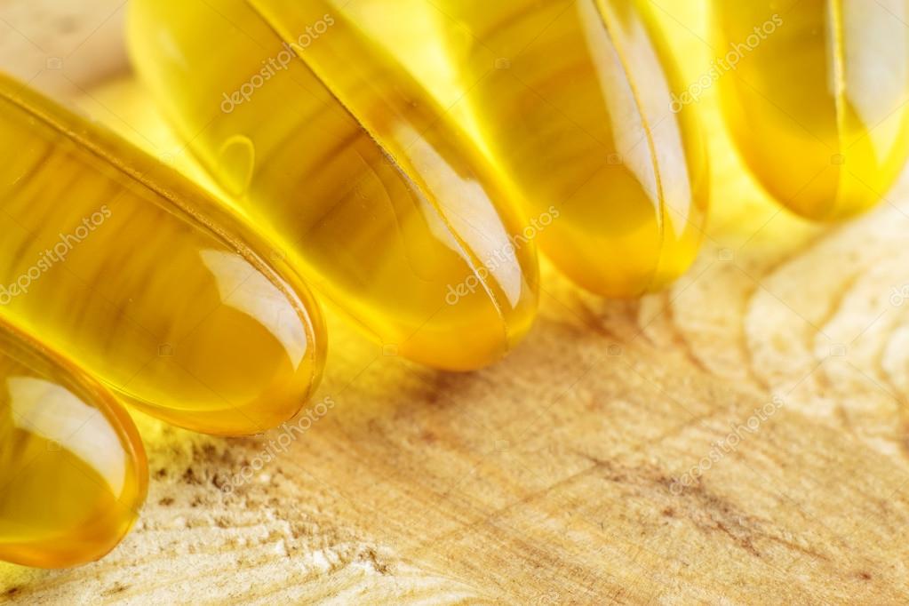 Fatty acid omega 3, fish oil gel capsules, macro image Stock Photo by