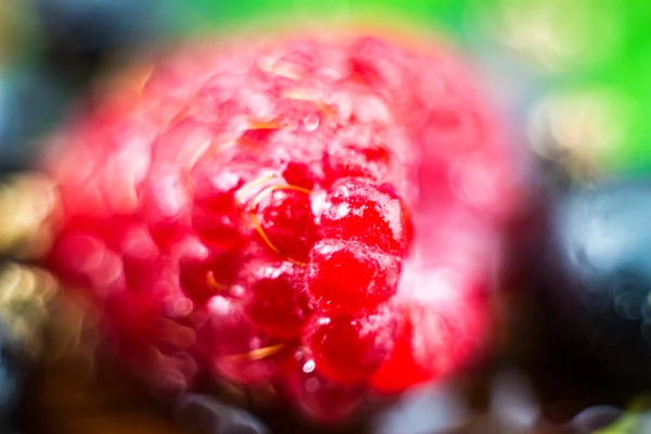 Macro shot of ripe raspberries, blurred fruit background with bokeh circles — Stock Photo, Image