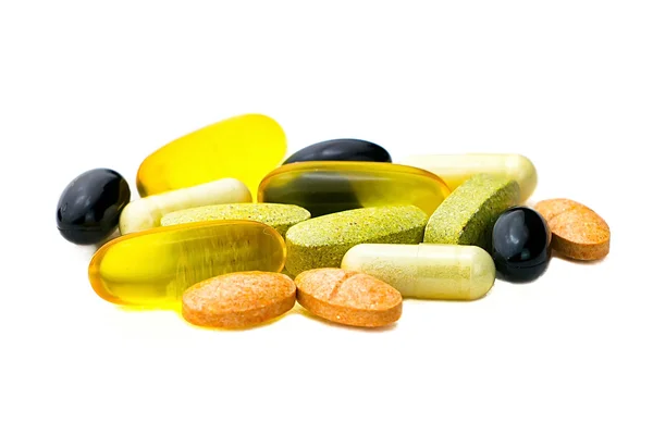 Gemischte Nahrungsergänzungsmittel Tabletten Nahaufnahme, Omega-3, Carotin, Vitamine lizenzfreie Stockbilder