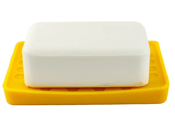 Vit tvål på gula innehavaren isolerad på vit bakgrund — Stockfoto