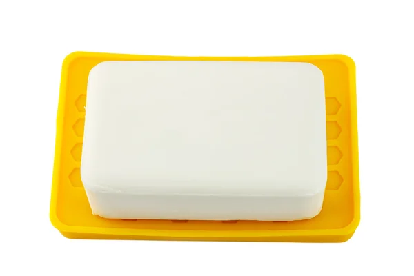 Vit tvål på gula innehavaren isolerad på vit bakgrund — Stockfoto