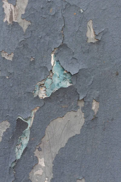 Sprucken bleknad blå vägg med avflagning av färg — Stockfoto