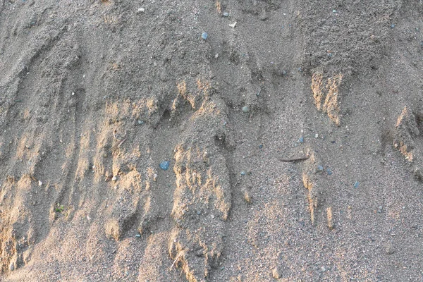 Getextureerd grijs droog natuurlijk zand achtergrond — Stockfoto