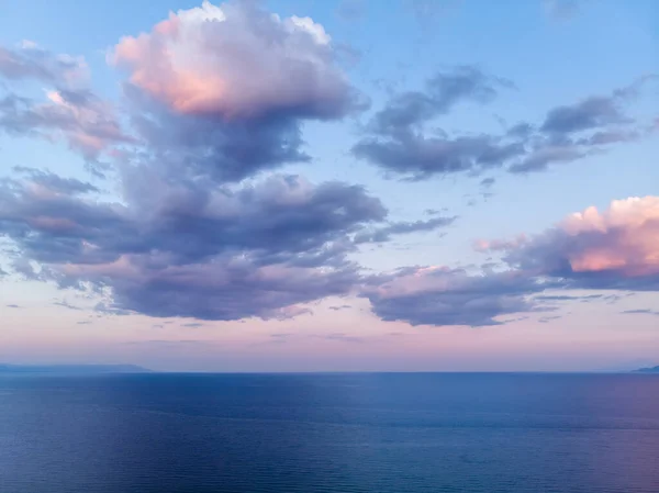 Dark blue and purple sky and sea after storm in Greece